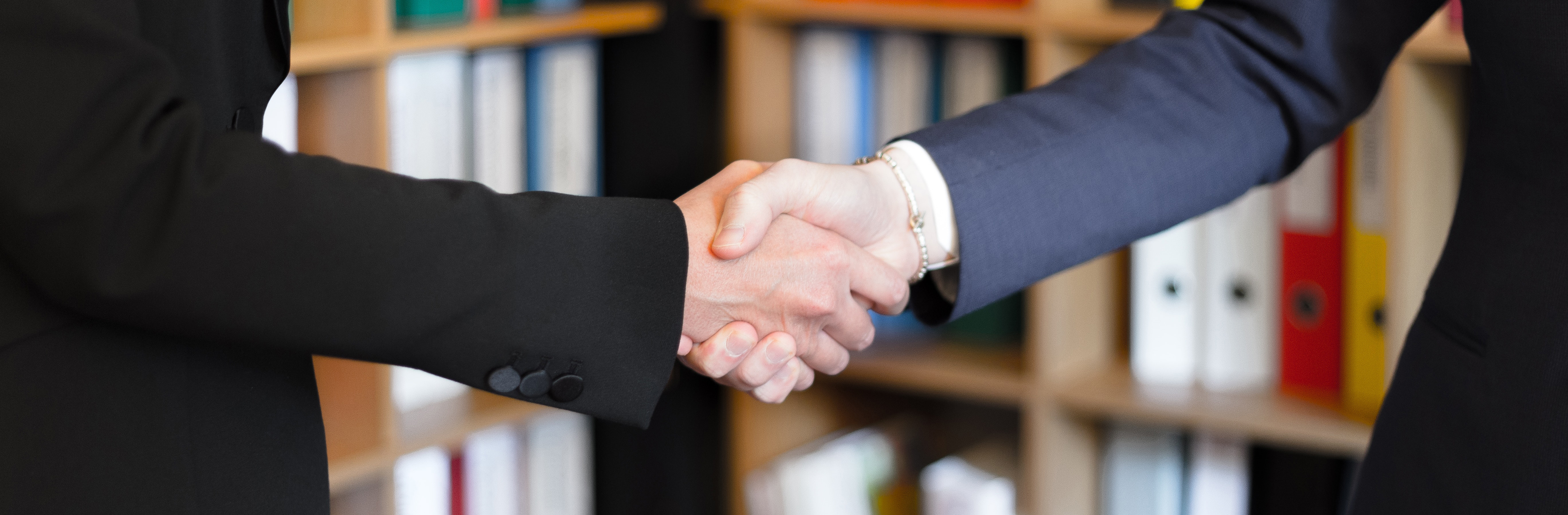 Title background of two people shaking hands